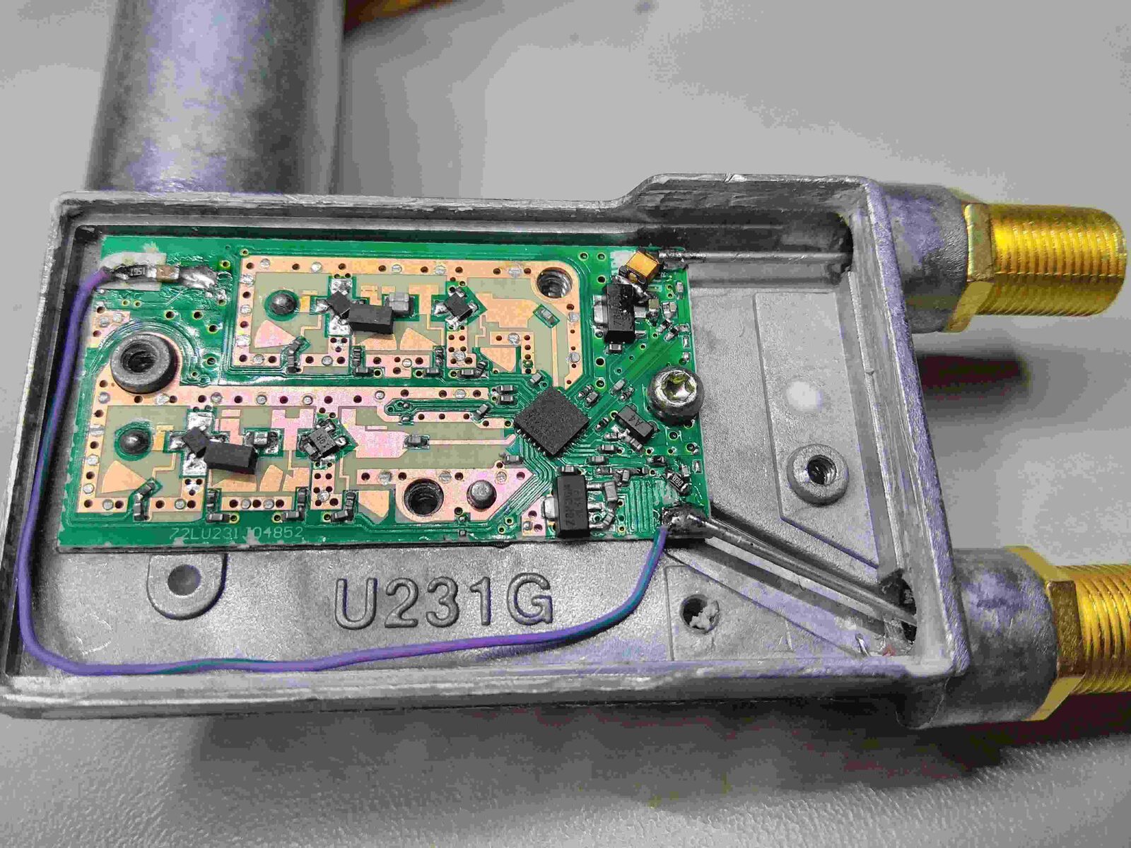 Golden Media 202 LNB opened, showing the PCB and the two F connectors